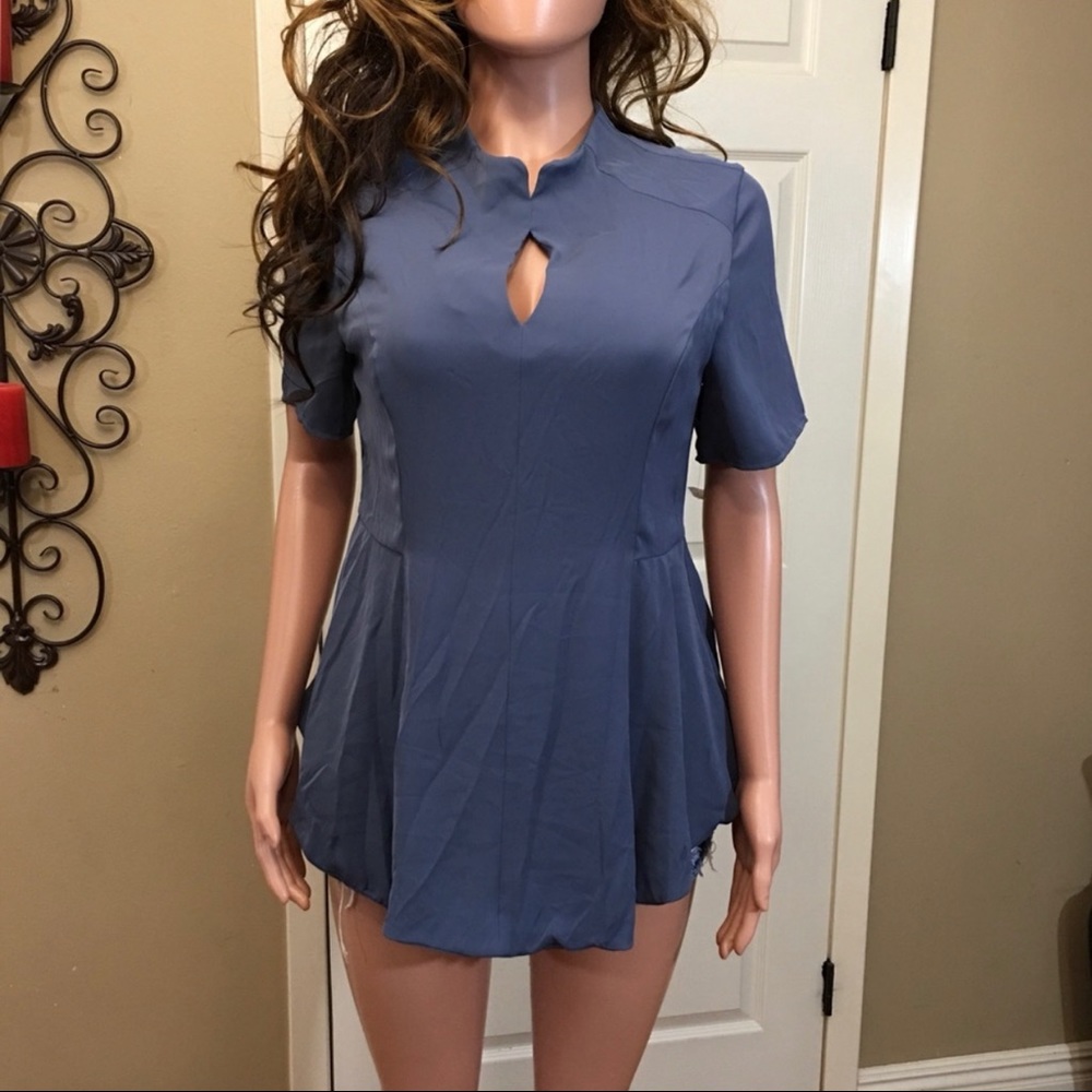 Blue peephole peplum top